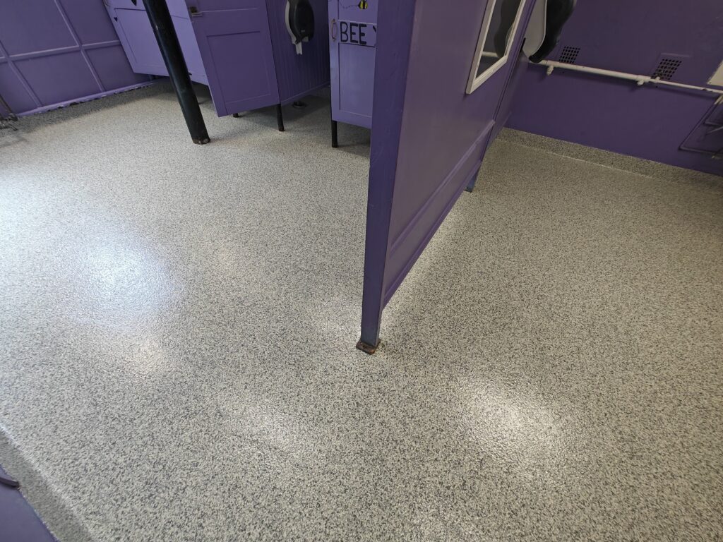 Public School in Mandeville LA removing their VCT flooring and installing Full Broadcast Flake System throughout their school-min