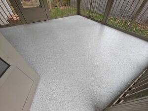 residential concrete coating Swan Flake over plywood base on this screened in porch near me Mandeville LA-min